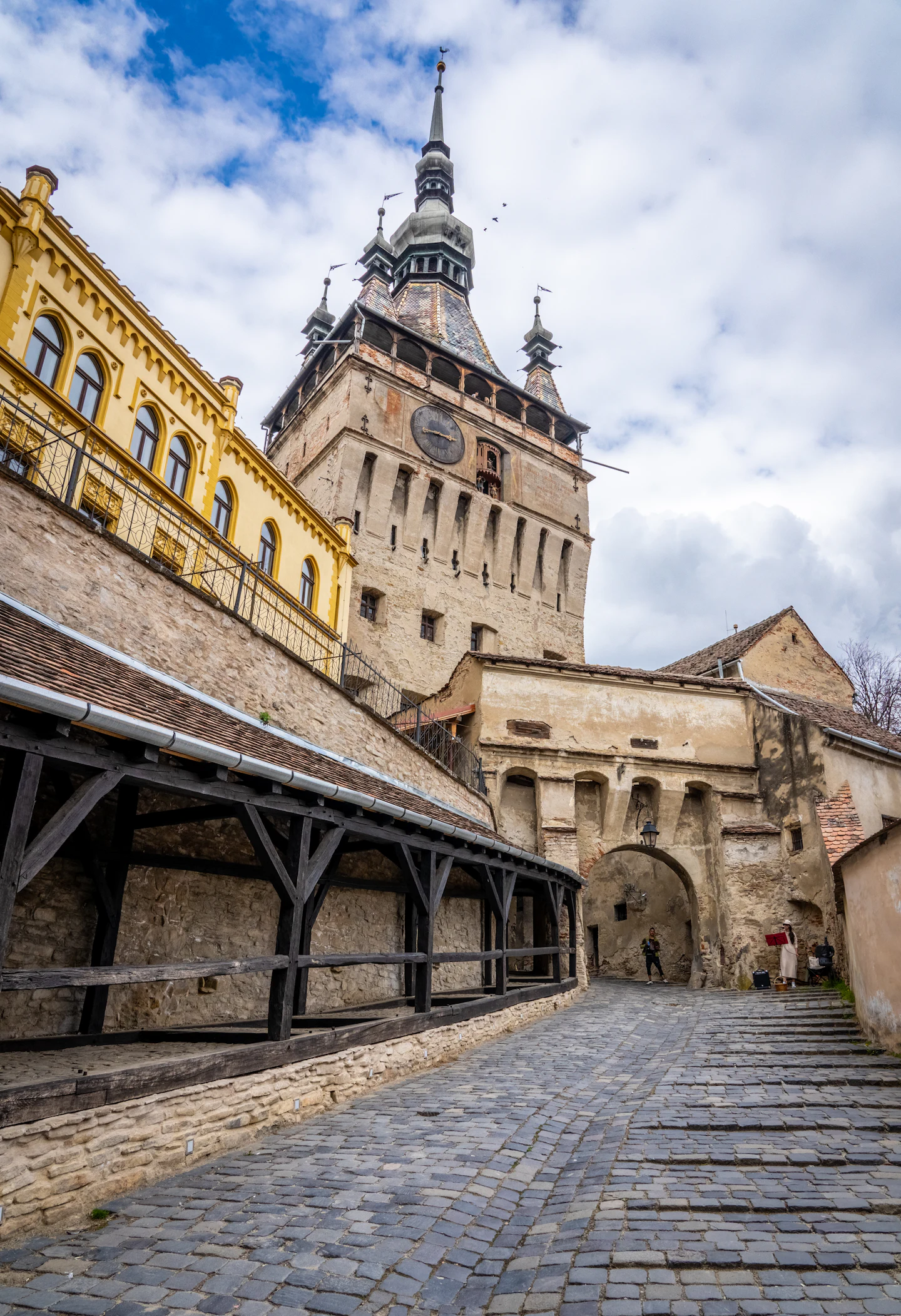 The Clock Tower of Sighișoara rising above the citadel rooftops